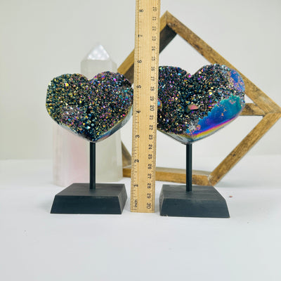 titanium coated heart on stand with decorations in the background