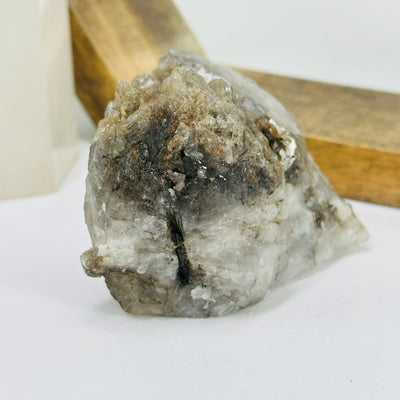 rutile quartz with decorations in the background