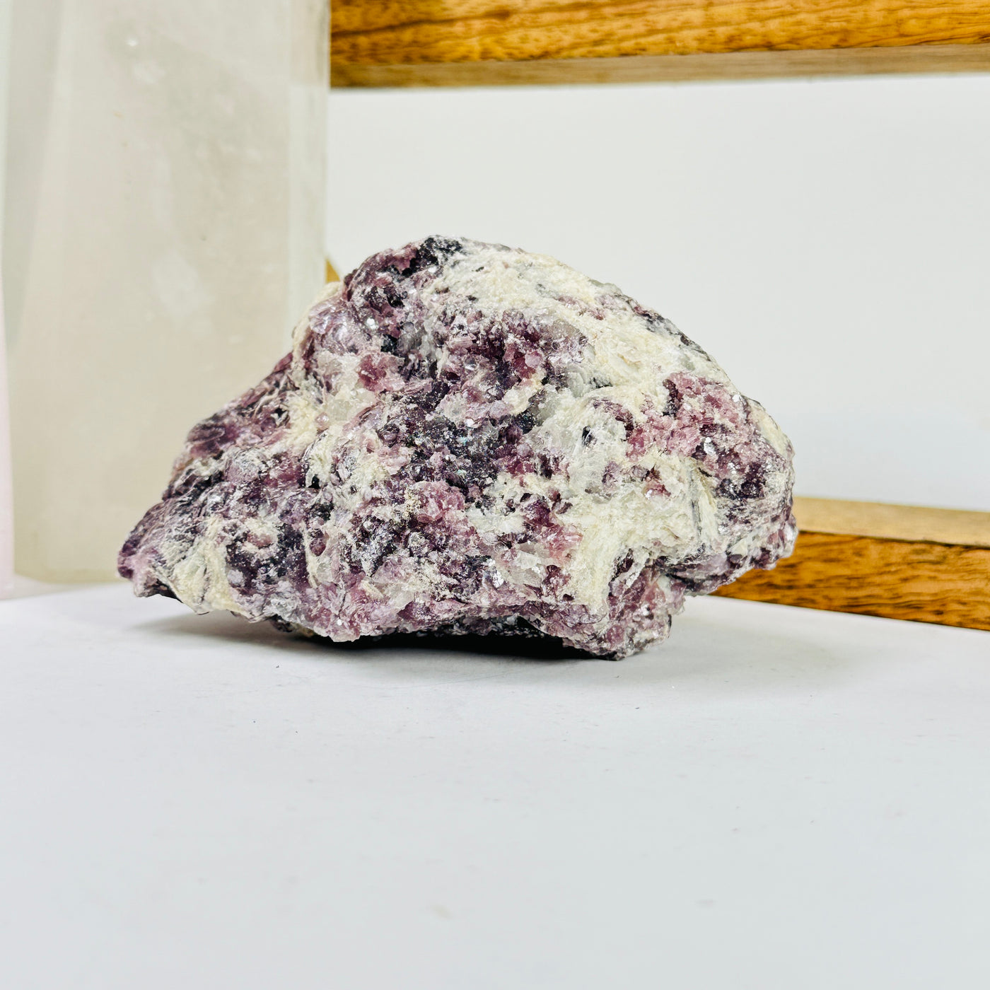 lepidolite with decorations in the background