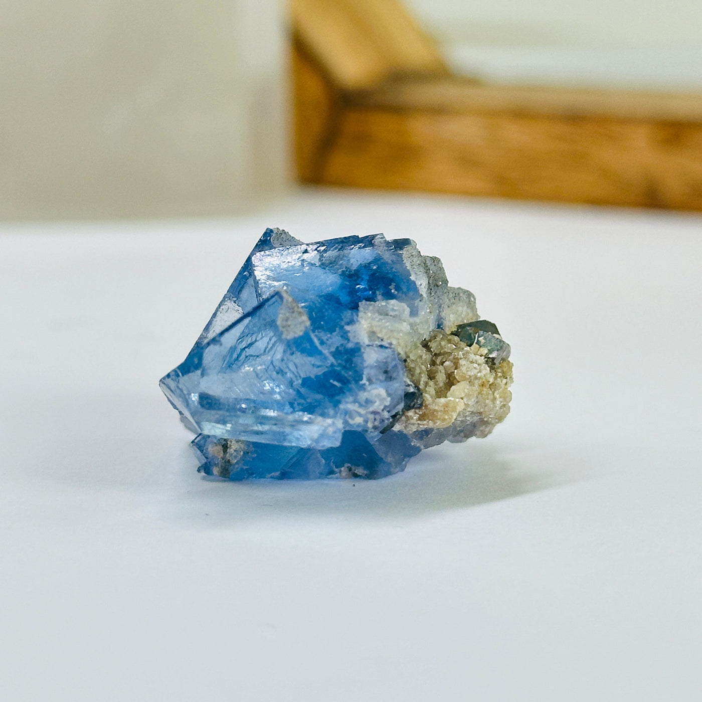 blue fluorite with decorations in the background