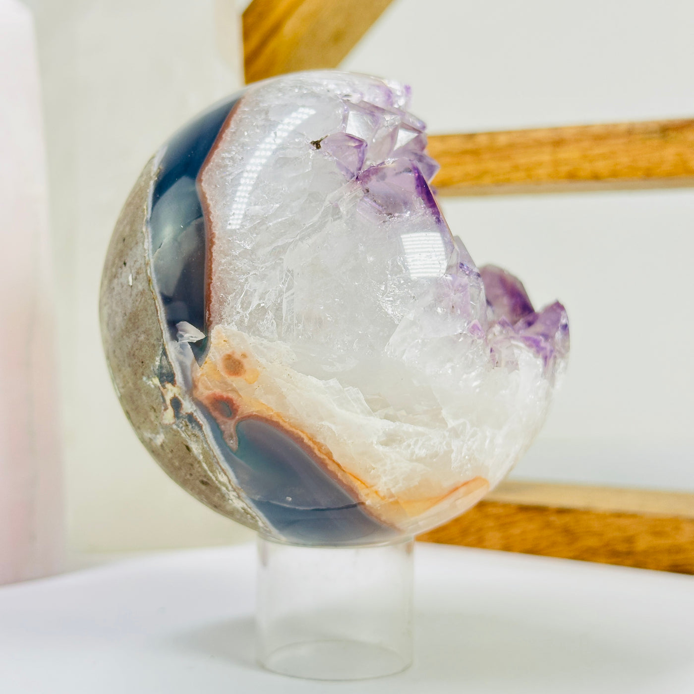 amethyst sphere with decorations in the background