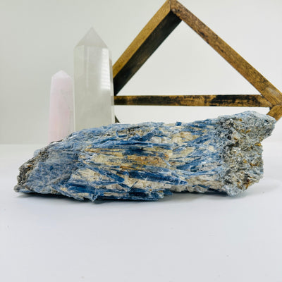 kyanite with decorations in the background