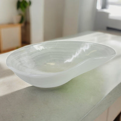 onyx bowl with decorations in the background