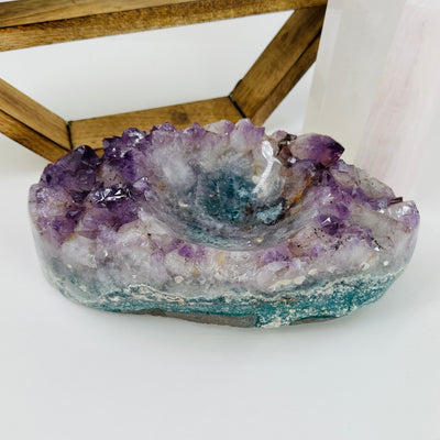 amethyst bowl with decorations in the background