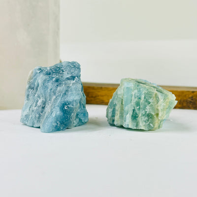 aquamarine stone with decorations in the background