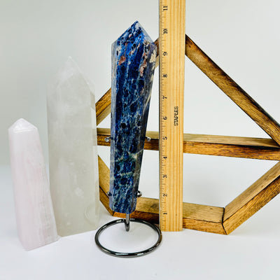 sodalite wand next to a ruler for size reference