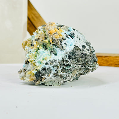 blue aragonite with decorations in the background