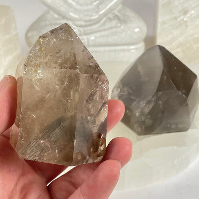 Crystal Quartz Point with Phantoms - You Choose #1 one in hand for size reference with the other variant in the background