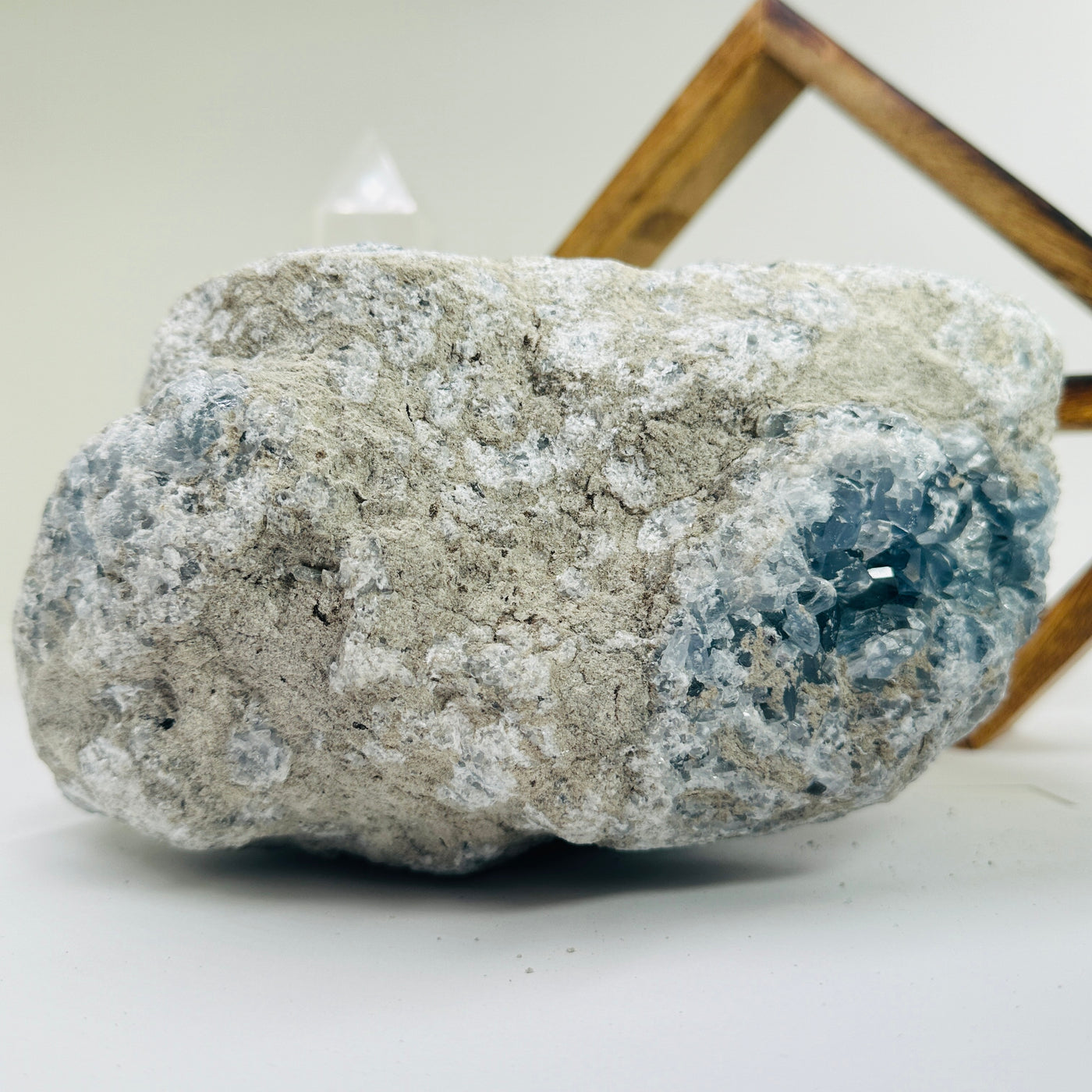 Celestite with decorations in the background