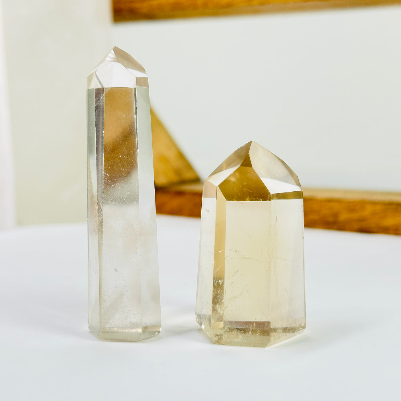 crystal quartz point with decorations in the background