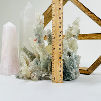 apophyllite with decorations in the background