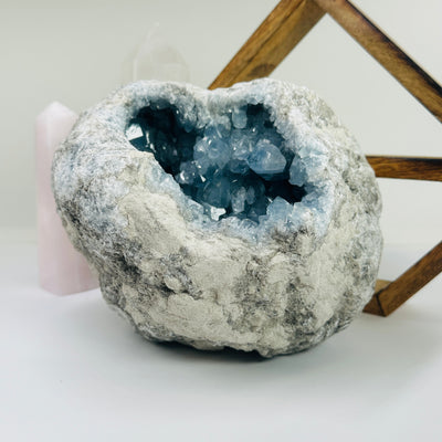 Celestite with decorations in the background