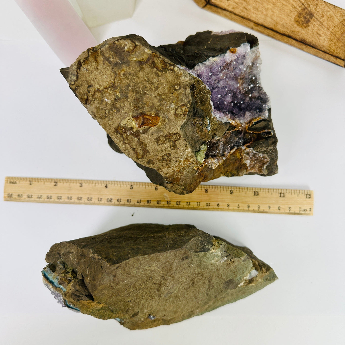 amethyst on matrix next to a ruler for size reference