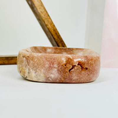 pink amethyst plate with decorations in the background