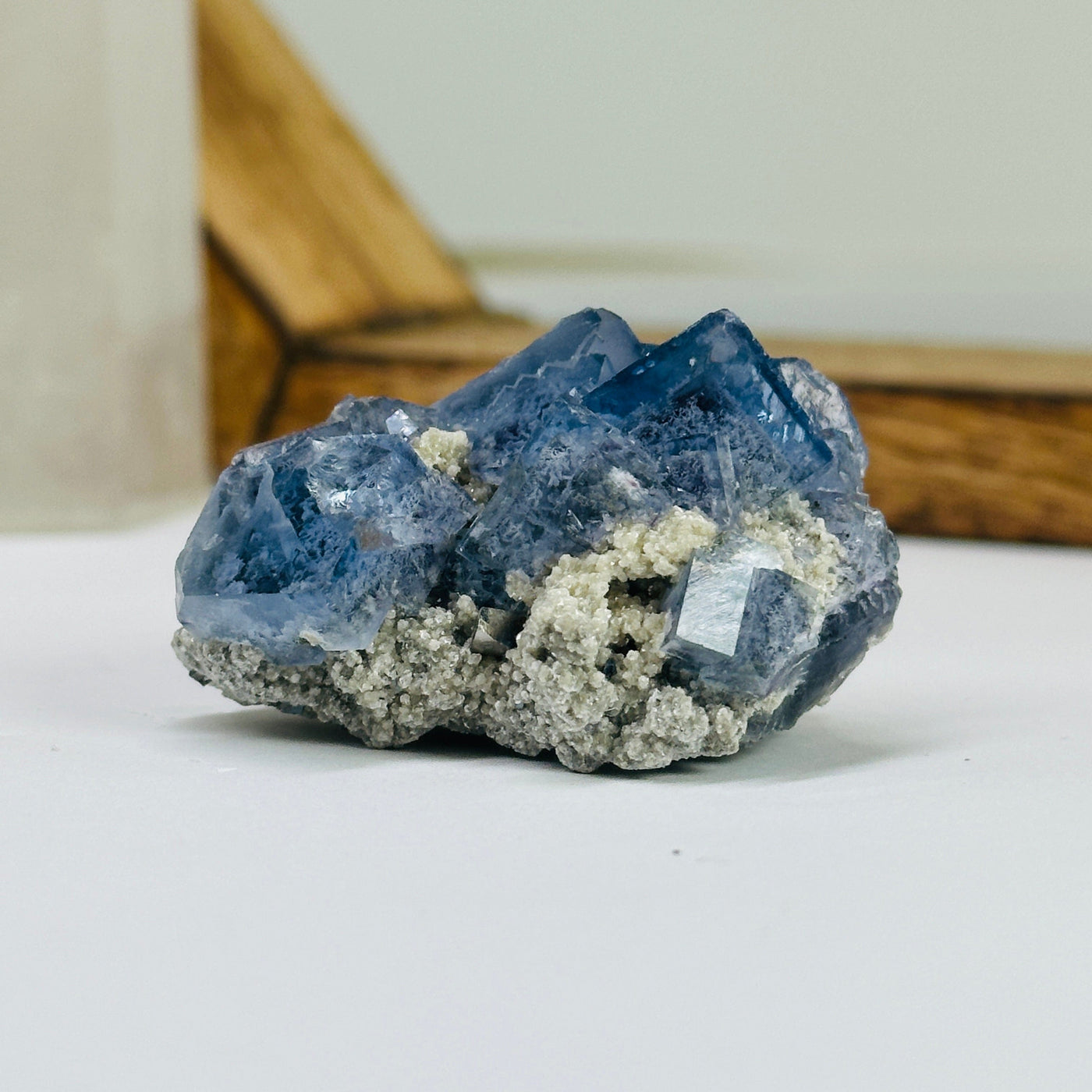 blue fluorite with decorations in the background