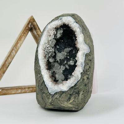 amethyst crystal cathedral with apophyllite with decorations in the background