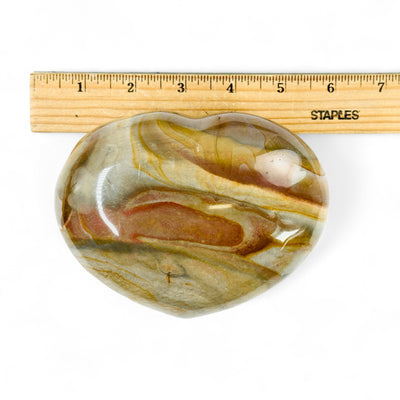 Polychrome Jasper Crystal Heart next to a ruler for size reference.