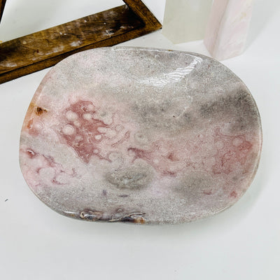 pink amethyst bowl with decorations in the background