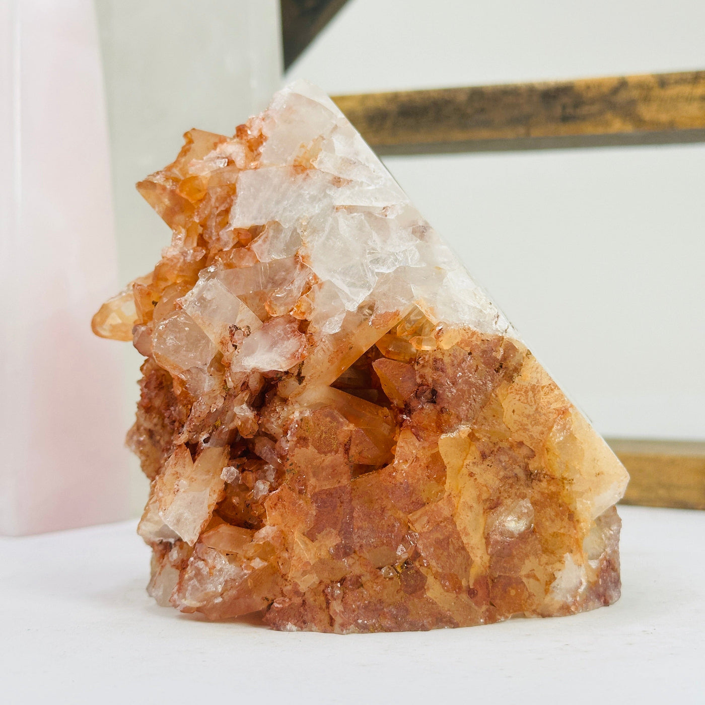 tangerine quartz points with decorations in the background