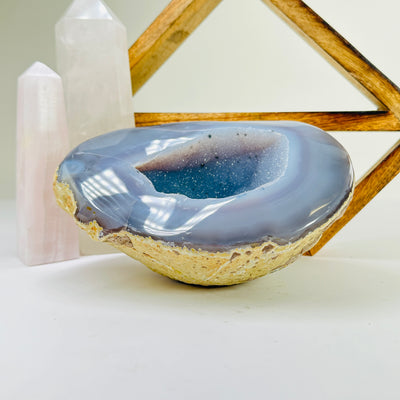 agate geode with decorations in the background