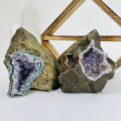 amethyst on matrix with decorations in the background