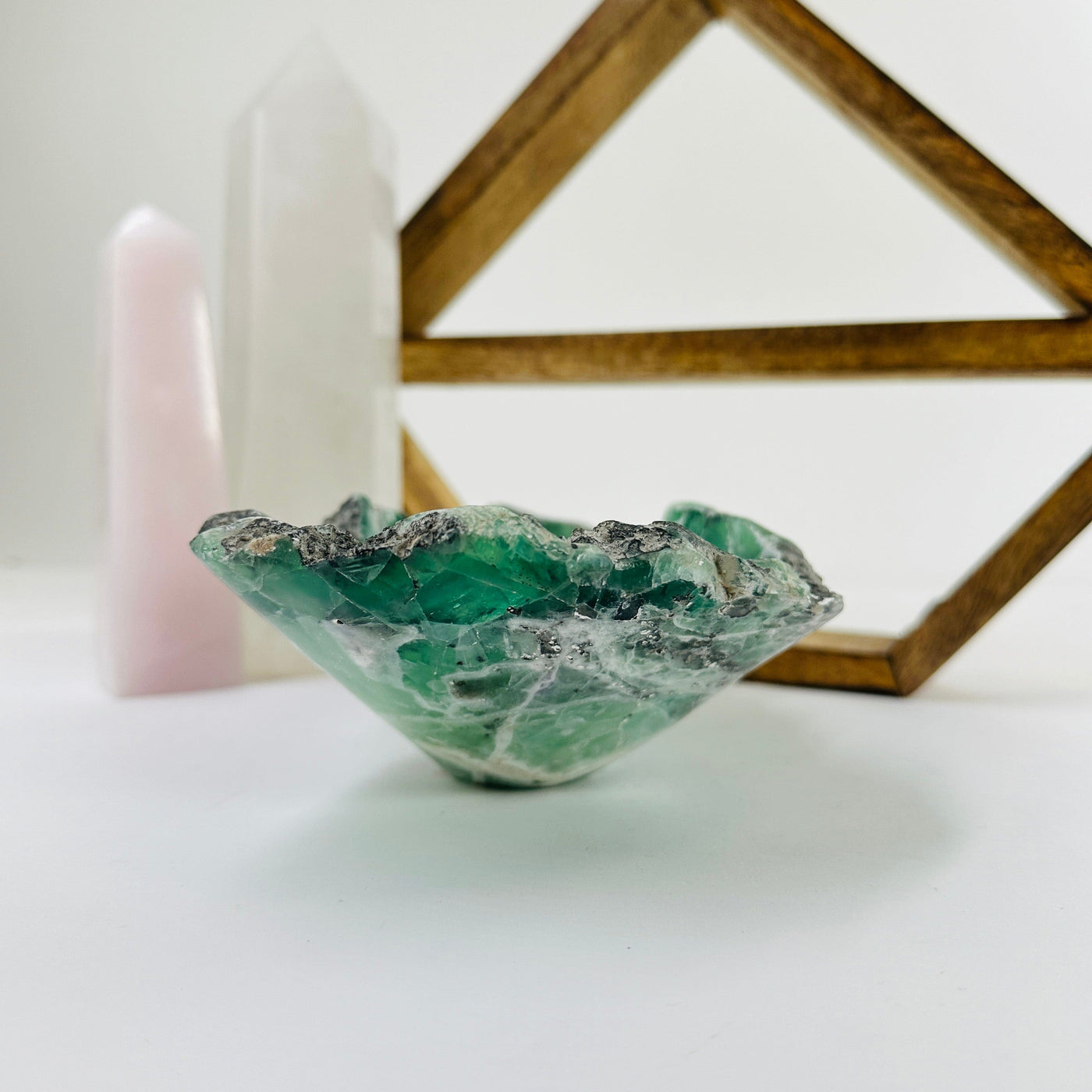 fluorite bowl with decorations in the background