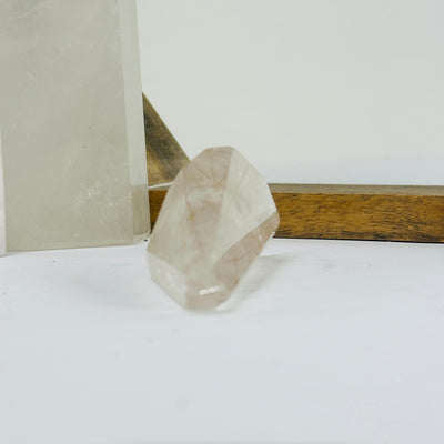 rutilated quartz with decorations in the background