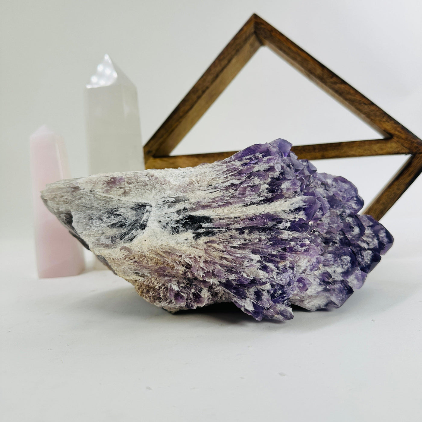 elestial amethyst with decorations in the background