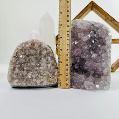 amethyst candle holder next to a ruler for size reference