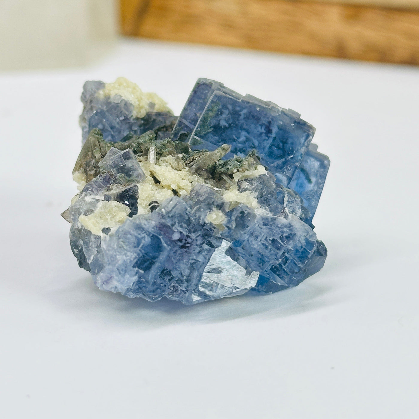 blue fluorite with decorations in the background