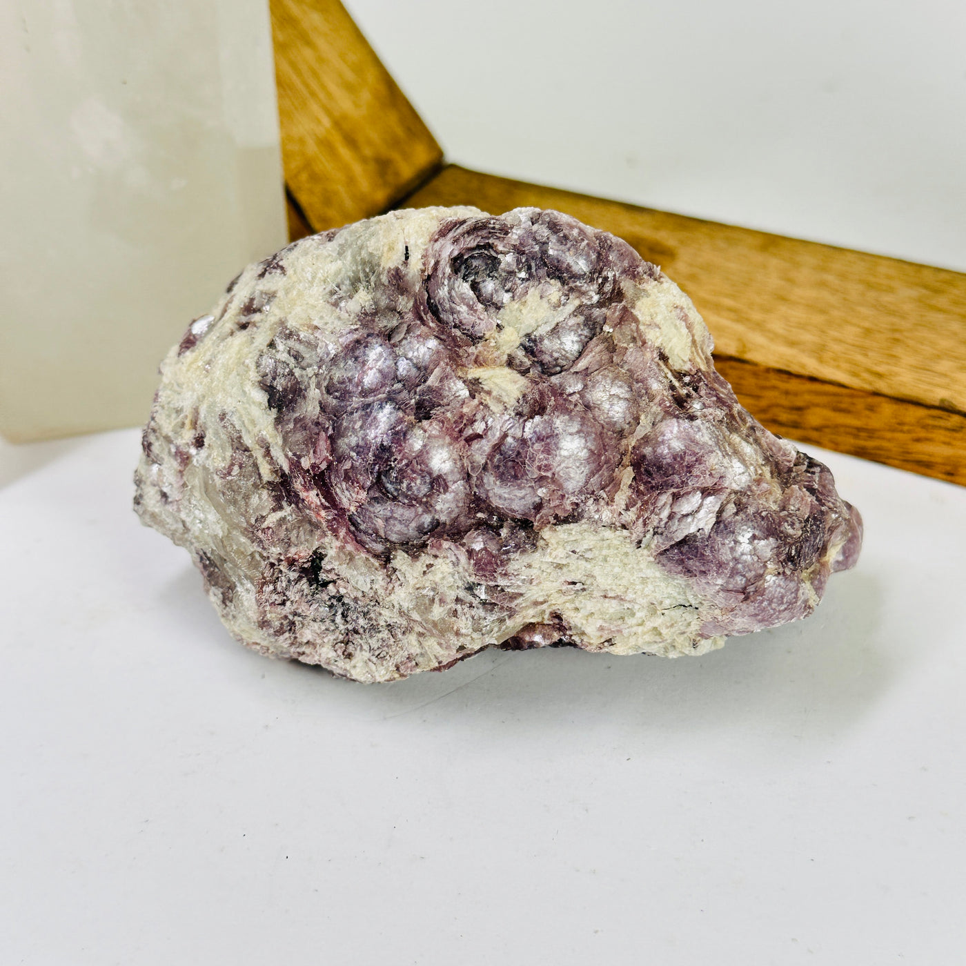 lepidolite with decorations in the background