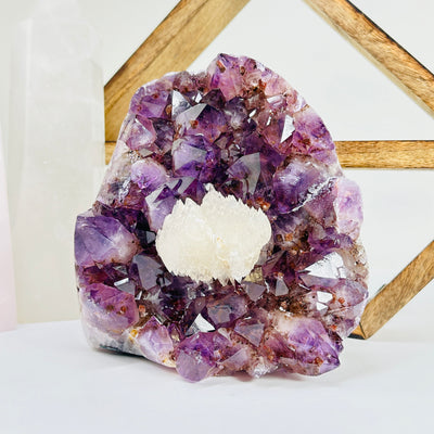 amethyst cut base with decorations in the background