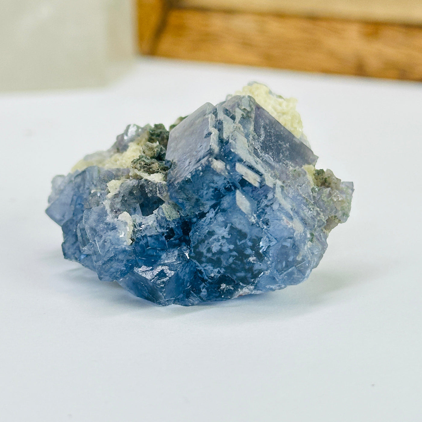 blue fluorite with decorations in the background