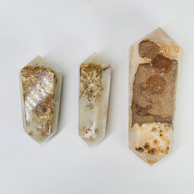 citrine double terminated point with decorations in the background