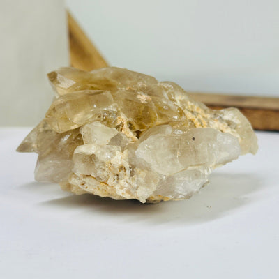 citrine cluster with decorations in the background