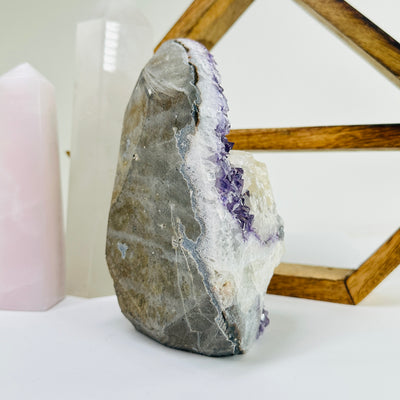 amethyst cut base with decorations in the background