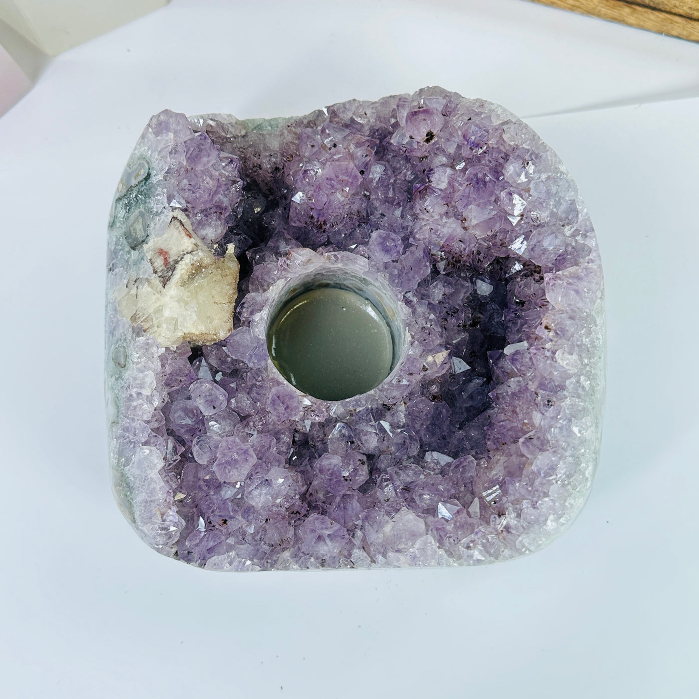 amethyst candle holder with decorations in the background