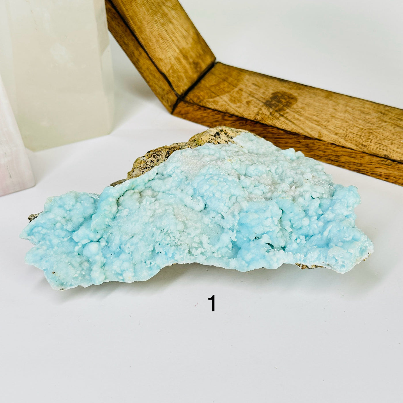 blue aragonite with decorations in the background