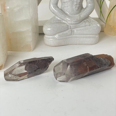 2 Garden Quartz Lodalite Polished Crystal Prisms on a table