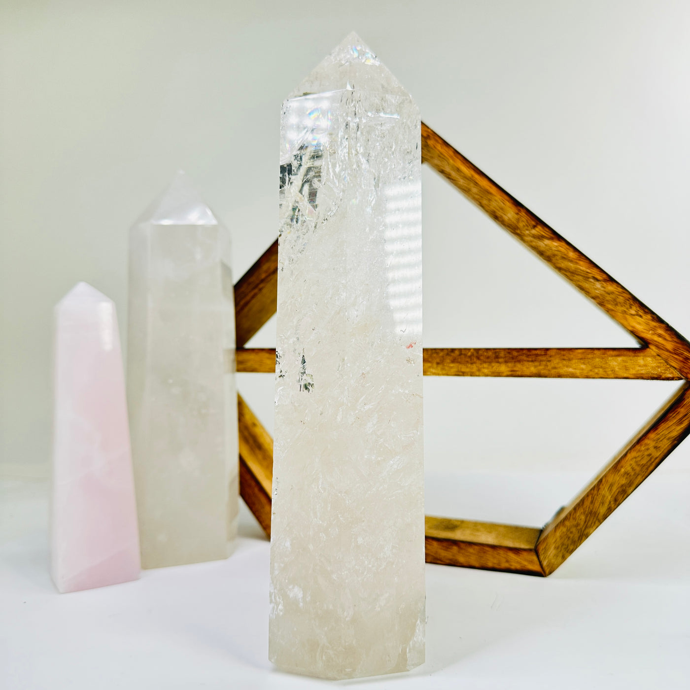 crystal quartz point with decorations in the background