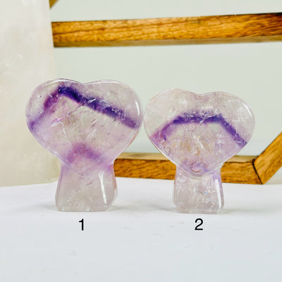 amethyst cut base with decorations in the background