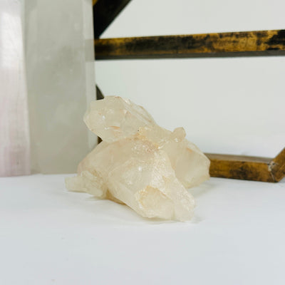 lemurian tangerine quartz with decorations in the background