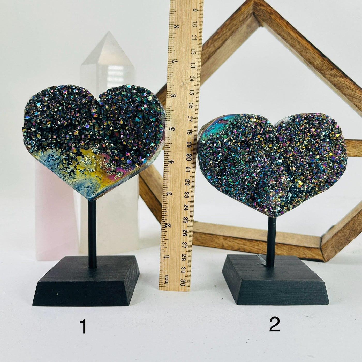 titanium coated hearts on metal stand with decorations in the background