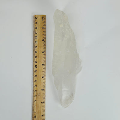 crystal quartz next to a ruler for size reference