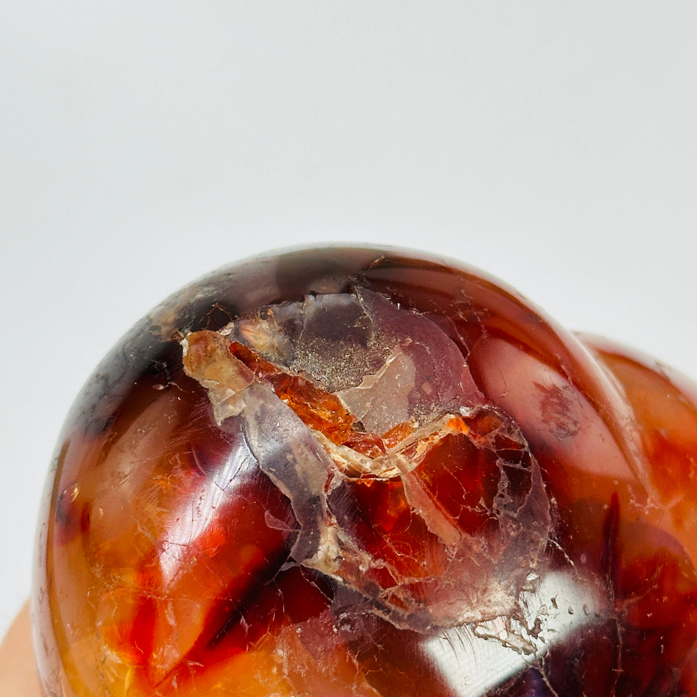 carnelian heart with decorations in the background