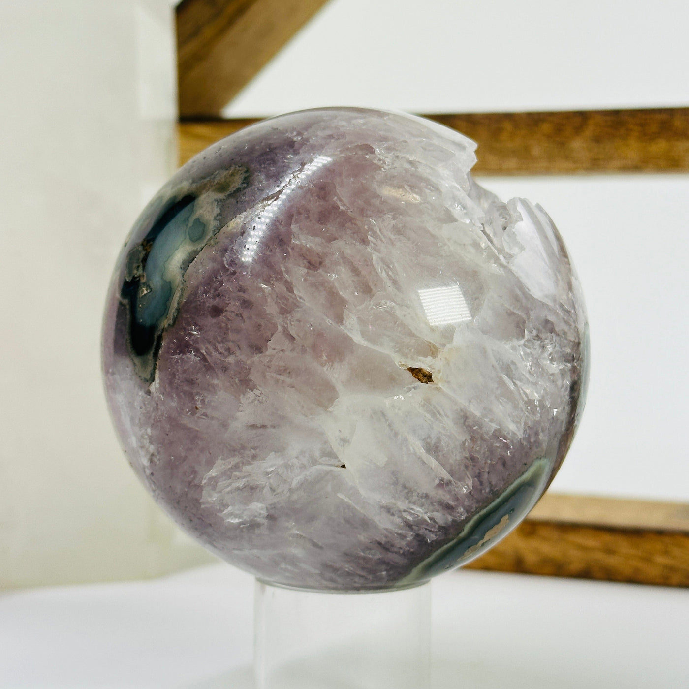 amethyst sphere with decorations in the background