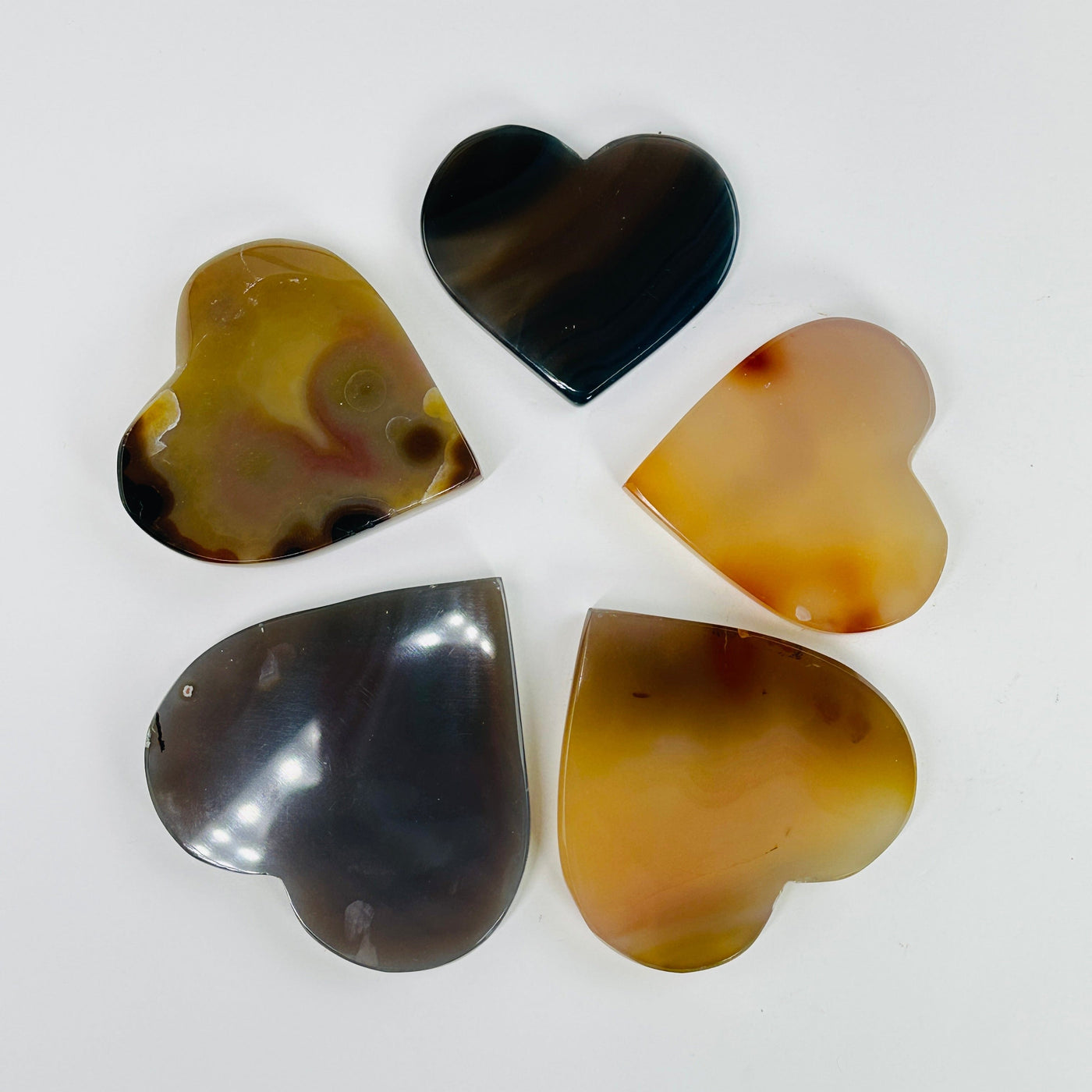 natural agate heart slices on white background