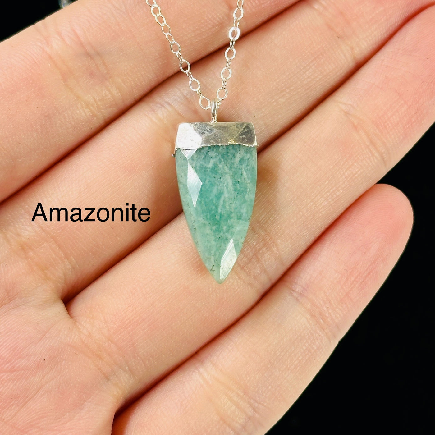 gemstone necklaces with decorations in the background