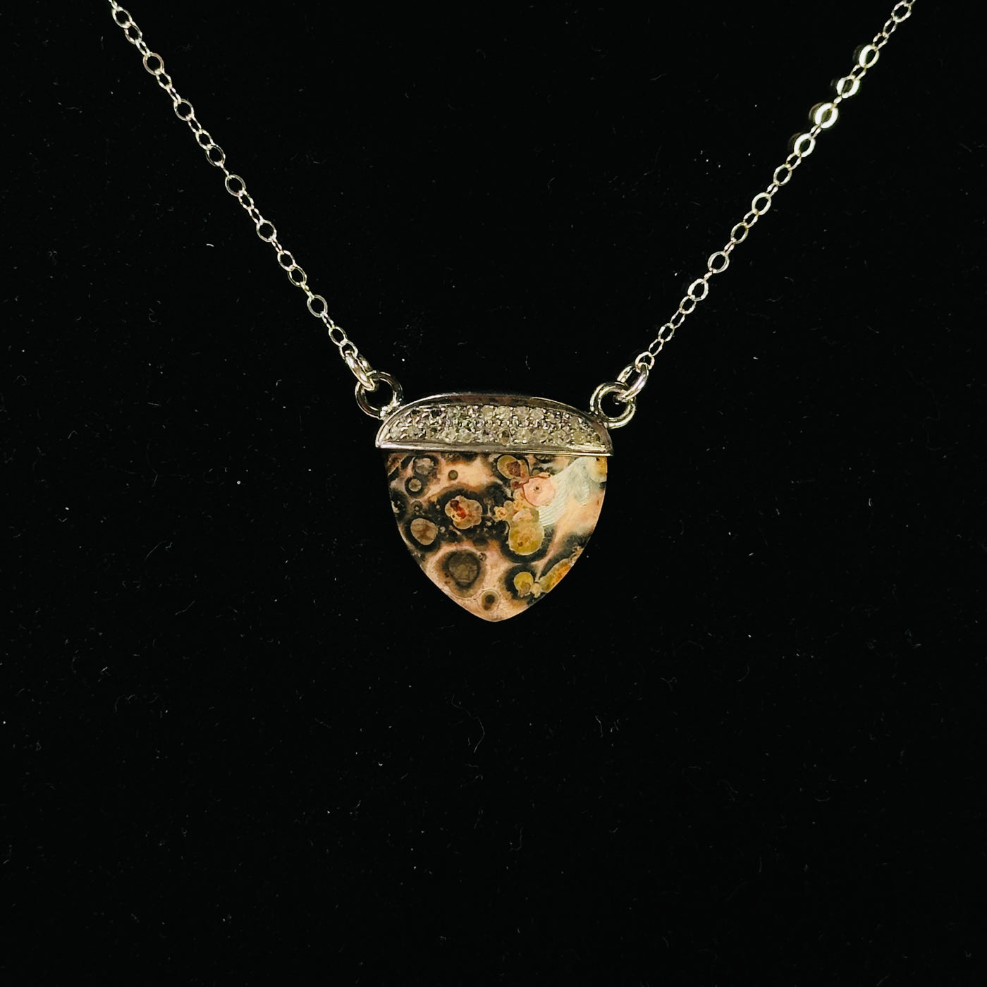 necklace with decorations in the background