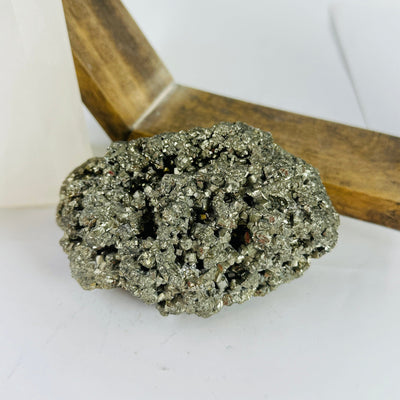 pyrite cluster with decorations in the background